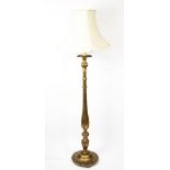 A carved gilt wood and gesso standard lamp, with fluted and gadrooned column,