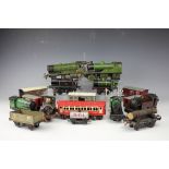 A collection of tin plate clock work locomotives, tenders, carriages etc,