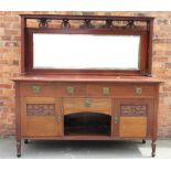 An Art Nouveau mirror back dresser in the manner of Liberty & Co,