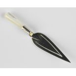 A silver page marker in the form of a trowel, with silver laid and mother of pearl handle,