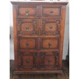A 17th century style oak chest, of small proportions, with four fielded drawers, on block feet,