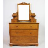 An Edwardian golden oak dressing table, with mirror and two drawers,