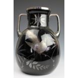 An Art Deco large HEM black glass vase, decorated with a silver bird and leaves, signed,