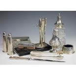 A selection of silver comprising; an Art Deco part manicure set on stand, Crisford & Norris Ltd,