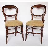 A set of four Victorian beech dining chairs, with cream upholstered seats,