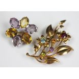 A multi gem set floral spray brooch, set throughout with semi-precious stones, stamped '9ct', 4.