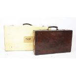 A Vintage vellum suit case, the lid with a label for 'Hotel Houmet Du Nord,