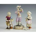 A German porcelain Meissen figure, modelled as an entertainer seated on marble plinth,
