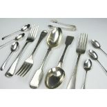A selection of silver cutlery comprising; two fiddle pattern table spoons, Charles Boyton & Son Ltd,