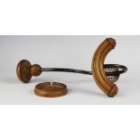 An Edwardian coat and hat hook, with turned wooden details,