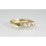 A five stone diamond ring, the five, graduated old cut diamonds,