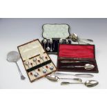 A set of six silver tea spoons and matching sugar tongs, with bright cut engraved detailing,