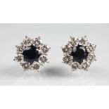 A pair of diamond and sapphire cluster earrings,