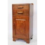 An Edwardian oak bedside cabinet, with two drawers and cupboard door, on bracket feet,