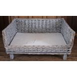 A contemporary wicker pets basket/bed,