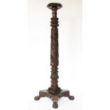 A 19th century carved mahogany torchere / jardiniere stand,