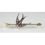 A diamond set swallow brooch,