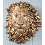 A pair of modern bronzed composition lions head wall mounts,