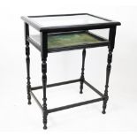 A late Victorian ebonised bijouterie table, with hinged top,