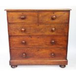 A Victorian mahogany chest, of two short and three graduated drawers, on bun feet, (top loose),