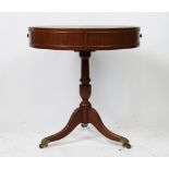 A Regency style drum top library table,