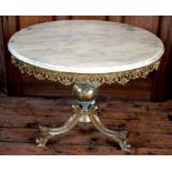 A marble top gilt brass coffee table, with pierced frieze, on scroll legs,