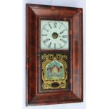 A late 19th century American walnut wall clock,