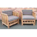 A pair of stained wood garden chairs, of cube form, with slatted backs and seats, 74.