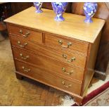 A George III style mahogany chest, with two short and three long drawers, on bracket feet,