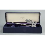 A Bentley letter knife, the blade with winged Bentley logo surmount, 18cm long,