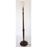 An early 20th century carved oak standard lamp, 151cm high,