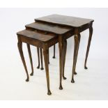 An early 20th century chinoiserie lacquered triple nest of tables, on tapered legs and pad feet,