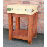 A modern Tanseli square butchers block, on stained wood base,