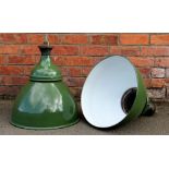 A pair of vintage green enamel industrial ceiling lights,