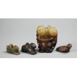 Four Chinese carved jade groups comprising; a Mandarin duck, 4cm long,