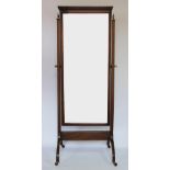 An Edwardian mahogany cheval mirror, on standard end supports, and out-swept legs,