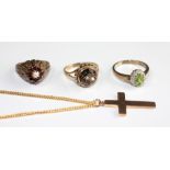 A 9ct gold cross with an attached gold plated chain, a 9ct gold smokey quartz set ring,