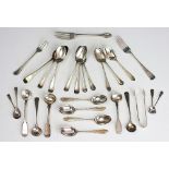 A selection of silver cutlery, including caddy spoons, dessert forks, tea spoons,