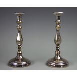 A pair of silver plated candlesticks, of heavy gauge, with hexagonal baluster columns,