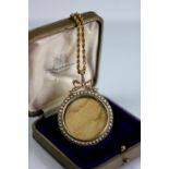 An Edwardian seed pearl set pendant and chain,