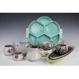 A collection of Poole pottery, to include two floral posy rings, a small vase, two sugar bowls,