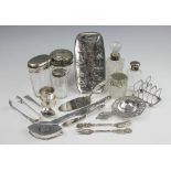 A collection of silver and white metal wares, to include; a Dutch silver straining spoon,