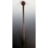 A late 19th century lignum vitae Knobkerrie, with ball terminal and three bound wire sections,