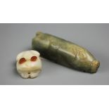 A Chinese carved jade scroll weight/pendant, modelled as a recumbent pig, 8.