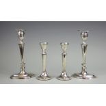 A pair of silver candlesticks, Thomas A Scott, Sheffield 1910, upon navette shaped bases, 18cm high,