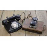 A vintage black bakelite telephone, handset marked 'P.L 35/234, G.P.O. No.
