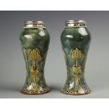 A pair of Royal Doulton Art Nouveau silver mounted vases, George Ernest Hawkins, Birmingham 1907,