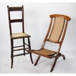 A late Victorian beech high back chair / correction chair, with caned seat and bobbin detailing,