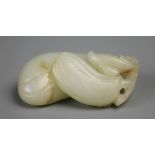 A Chinese light celadon Jade carving of a double peach descending from a stem,