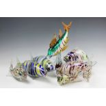 A collection of twelve Murano style glass fish to include a diving example, 37.